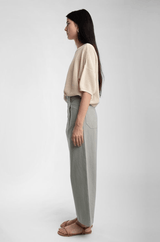 side view of model with moss green lou trouser 