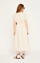 back of hand printed bohemian dress in tan and white